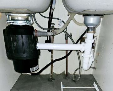 Plumbing parts, tools, and plans used by LeakResq Plumbing LLC.